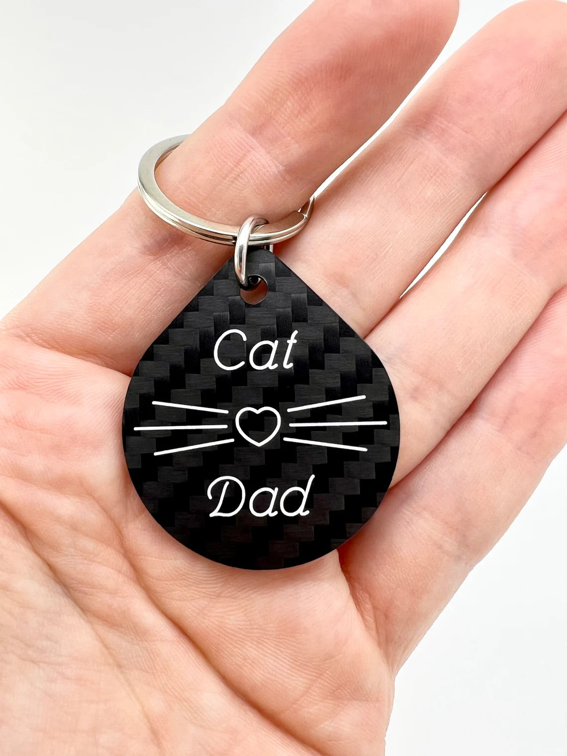 engraved carbon fiber keychain cat dad in hand