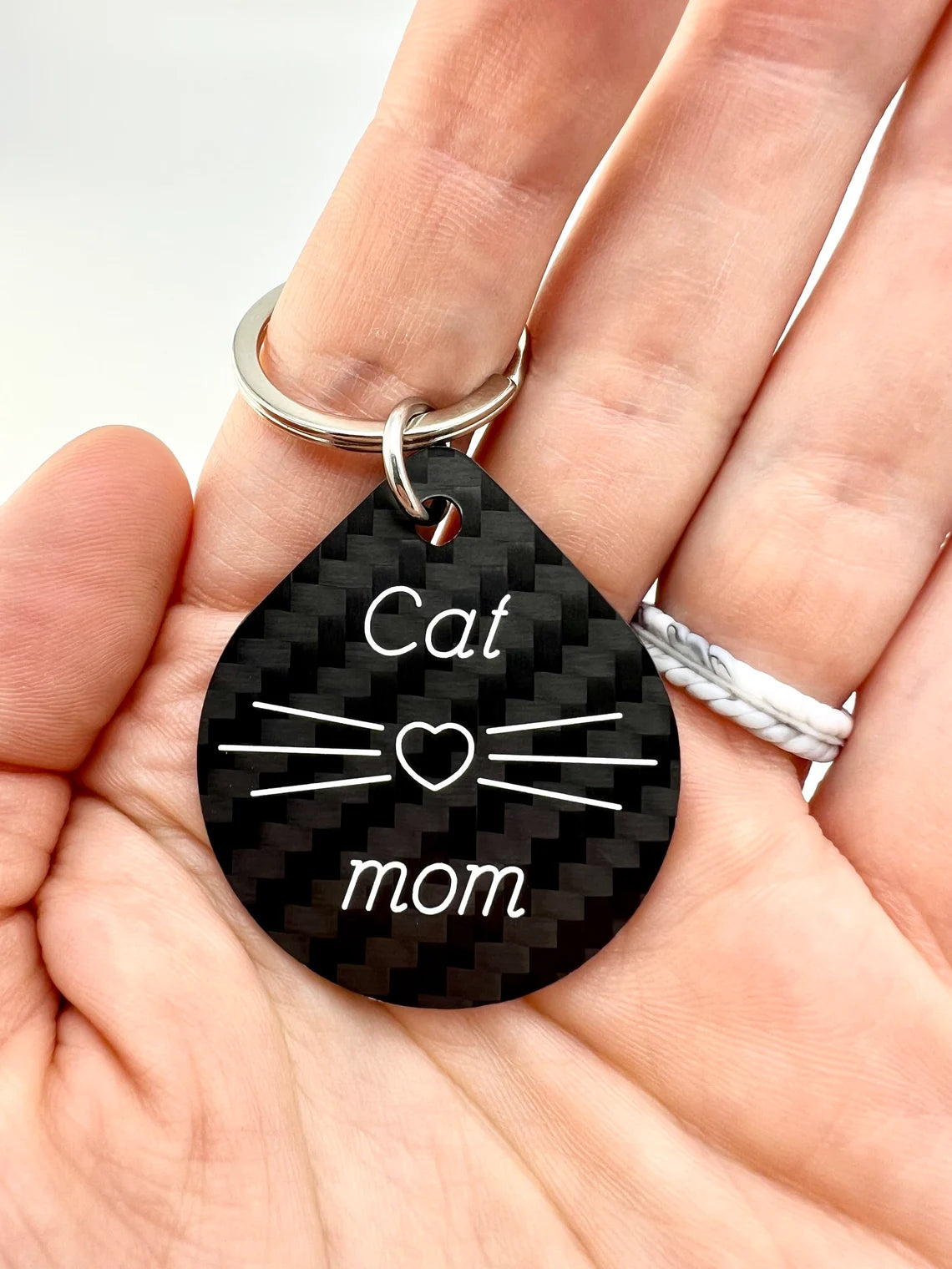engraved carbon fiber keychain cat mom in hand